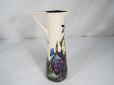 Moorcroft Pottery - a Moorcroft Pottery vase in the Walnut Tree pattern,