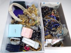 Two shoe boxes containing a large quantity of costume jewellery to include necklaces, bracelets,