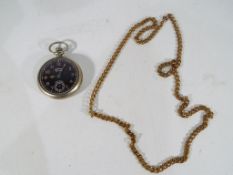 An Ingersoll white metal open faced pocket watch, Arabic numerals on a black dial,
