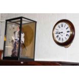 Glass cased model of a Samurai warrior and circular mahogany cased wall clock