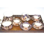 Six Royal Crown Derby cups and saucers,