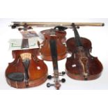 Three vintage violins and three bows