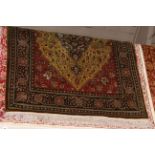 Indian rug with a green ground 1.90 x 1.