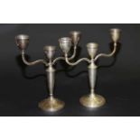 Near pair of silver three-light candelabra