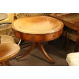 Mahogany tripod drum style table with frieze dummy and pull out drawers and leather inset top