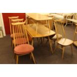 Ercol Windsor drop leaf table and seven chairs (6+1)