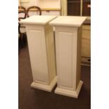 Pair of white painted square column pedestal stands,