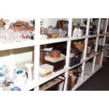 Full shelf of teaware, glassware, wood boxes, books, fur coats, dessert set,