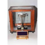 Old fashioned pharmaceutical scales and weights by Baird and Tatlock