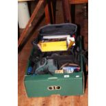 Box of photographic equipment including cameras, lenses, tripod,