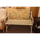 Wrought iron garden bench in cream painted finish with butterfly design back