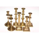 Three pairs of odd Victorian brass candlesticks