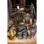 Brass jam pans, two kettles, pair of candlesticks, fire front,