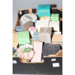 Box with mostly scent bottles, compacts,