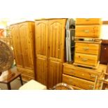 Pine six piece bedroom suite comprising two wardrobes, four height chest,