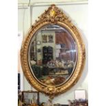 Large oval gilt framed bevelled wall mirror