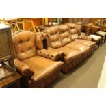 Brown buttoned leather three seater wing back settee and chair