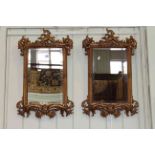 Pair rectangular ornate gilt framed bevelled wall mirrors