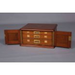 A LATE VICTORIAN MAHOGANY CANTEEN CASE, the moulded top with brass inset monogrammed plaque,