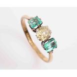 AN EMERALD AND DIAMOND RING,