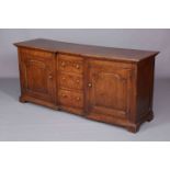 A GEORGE III OAK DRESSER BASE, with inverted breakfront,