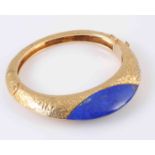 A LAPIS LAZULI AND GOLD BANGLE BY KUTCHINSKY, circa 1970,