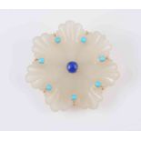 A JADEITE, TURQUOISE AND LAPIS LAZULI BROOCH, carved as a flower head with seven petals,