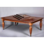 A LARGE VICTORIAN MAHOGANY WINDOUT EXTENDING DINING TABLE, extending to 12'8", with rounded corners,