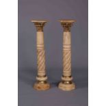 A HANDSOME PAIR OF MARBLE AND GILT-METAL TORCHERES, with twist carved stems. 123.