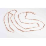 A LATE VICTORIAN ROSE GOLD GUARD CHAIN,