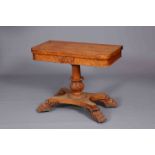 A WILLIAM IV BIRDS EYE MAPLE FOLDOVER CARD TABLE, with boldly carved leaves to the stem,