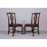 A PAIR OF 18TH CENTURY MAHOGANY SIDE CHAIRS, each with yoked crest rail and openwork splat,