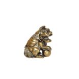 A CHINESE BRONZE OF A FOO DOG, typically cast with foot resting upon a ball. 5.