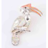 A SILVER AND OPAL BROOCH, modelled as a parrot perched on a branch, the body,