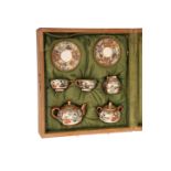 A JAPANESE SATSUMA MINIATURE TEA SERVICE, comprising teapot, sucrier,