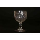 AN EARLY 19TH CENTURY ETCHED GLASS WINE, with baluster stem.