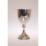 A LATE VICTORIAN SILVER GOBLET, London 1891, of simple form with moulded foot, no engraving. 9.