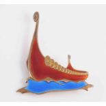 AN ENAMEL AND SILVER GILT BROOCH BY ALBERT SCHARNING, modelled as a Viking ship,