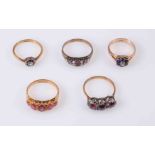 A COLLECTION OF FIVE GEM SET RINGS, each set with stones to include synthetic sapphires,