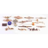 A COLLECTION OF EIGHTEEN GEORGIAN AND VICTORIAN BROOCHES AND TIE PINS,