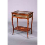 A FRENCH 19TH CENTURY MARQUETRY AND ROSEWOOD BIJOUTERIE TABLE, the hinged lid with shaped "frame",