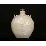 A CHINESE CELADON FLASK, the moulded body with twin loops for suspension and stopper.