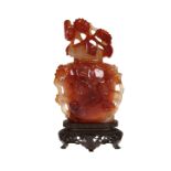 A CHINESE CARVED AGATE VASE AND COVER, PROBABLY 19TH CENTURY, carved with bird and foliage,