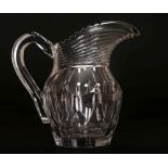 AN IRISH CUT GLASS WATER JUG, EARLY 19TH CENTURY, with prism cut neck.