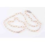 A SALTWATER PEARL AND DIAMOND NECKLACE,