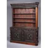 A LARGE FLEMISH STYLE OAK BOOKCASE, 19TH CENTURY, the upper section now open and with carved frieze,