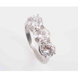 A THREE STONE DIAMOND RING,