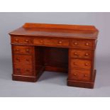 A MID VICTORIAN MAHOGANY DESK,