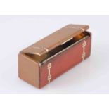 A FINE ART DECO CARTIER RED ENAMEL AND SILVER GILT BOX, in the form of a casket, no.