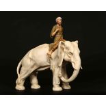 A ROYAL DUX MODEL OF AN ELEPHANT AND RIDER, CIRCA 1910-1920, the rider dressed in robes, no. 1879/4.
